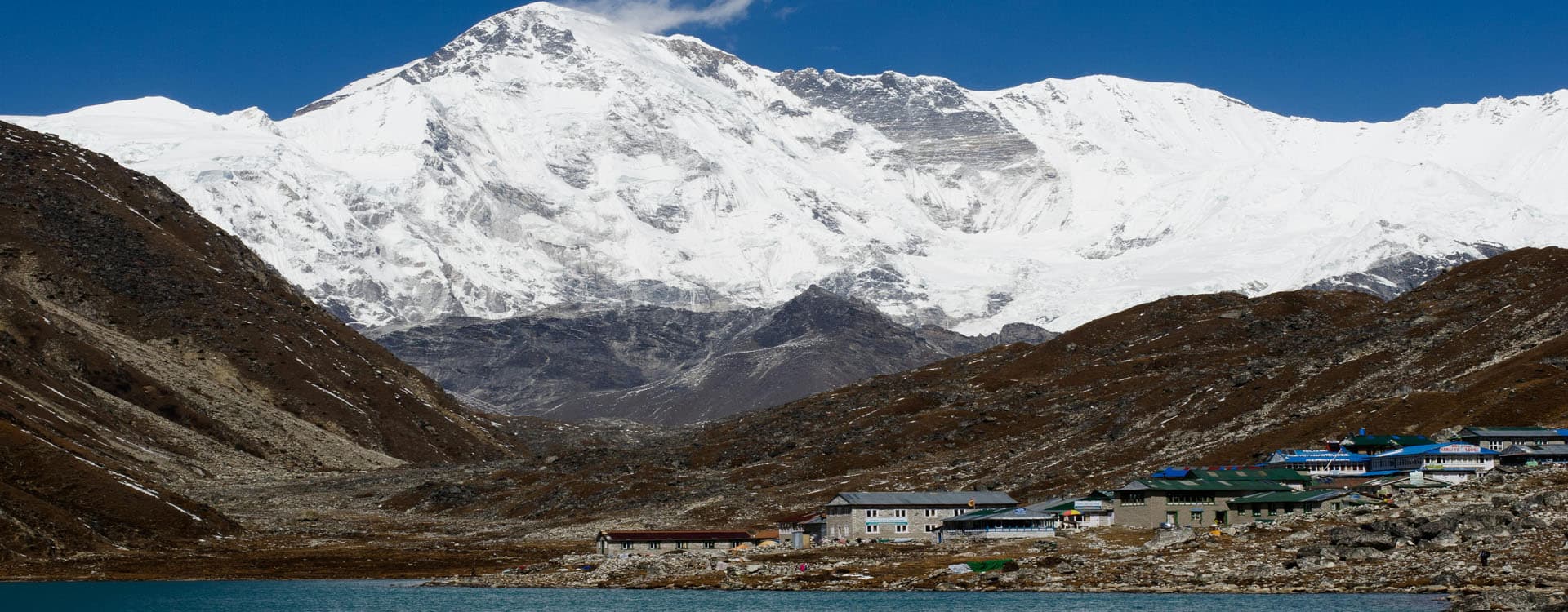 Snow Covered Mountain and a small village in Nepal